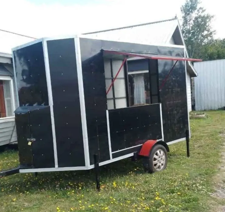 Compact black food truck trailer