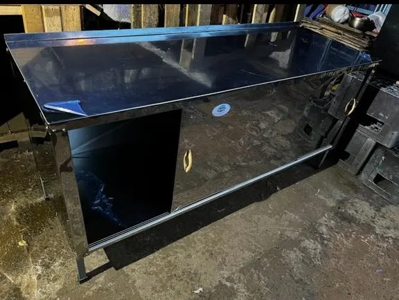Stainless steel work table with sliding doors